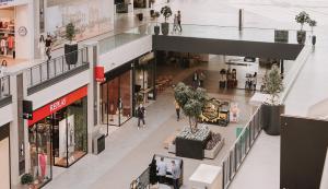 an overhead view of a shopping mall with people walking in it at Luxury Studio Belgrade Waterfront in Belgrade