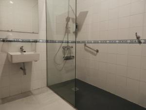 a bathroom with a shower and a sink at Hotel Doña Blanca in Seville +36 photos