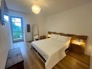 Ένα ή περισσότερα κρεβάτια σε δωμάτιο στο Appartamento Elegante con Servizi in oasi verde