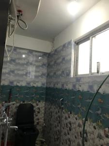 Koupelna v ubytování Naayuma Homestay + 10 fotografií