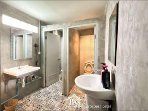 a bathroom with a sink and a toilet and a tub at BG prosper Hostel in Ban Don Muang (1) +45 photos