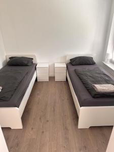 Katil atau katil-katil dalam bilik di 3 Schlafzimmer Wohnung für 6 Personen in Wörrstadt inkl Terrasse & Garten