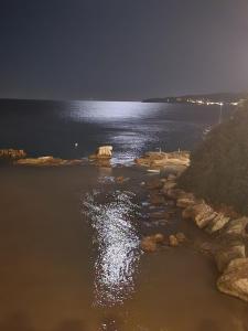 a view of a large body of water at night at A casa di Mary in Vieste