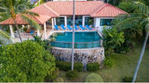 an aerial view of a house with a swimming pool at Villas Bangrak Samui in Koh Samui 