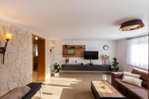 a living room with a couch and a table at Fewo Schuch in Pirna
