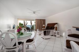 a living room with a table and chairs at Charming apartment in Lowlands with shared pool, 87 m² in Lowlands