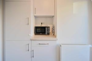 Kuchyň nebo kuchyňský kout v ubytování Bungalow Nr 1 "Grünewald" Birkenweg 2