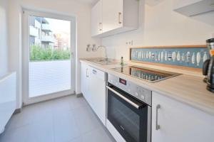 Kuchyň nebo kuchyňský kout v ubytování Bungalow Nr 1 "Grünewald" Birkenweg 2