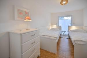 Postel nebo postele na pokoji v ubytování Bungalow Nr 1 "Grünewald" Birkenweg 2