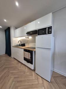 Η κουζίνα ή μικρή κουζίνα στο Studio Cosy - Proche frontière