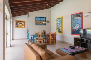 a living room with a couch and a table at Rincón del Sol, country charm in the heart of the capital in Asuncion