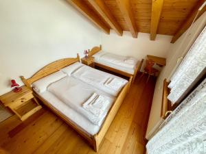 an overhead view of a bedroom with two beds at La Sghirata in Venas