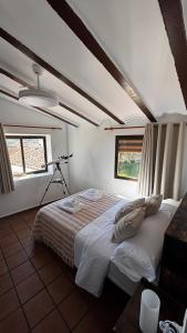 a bedroom with a large bed in a room at La Casa de la Abuela in Higueruela