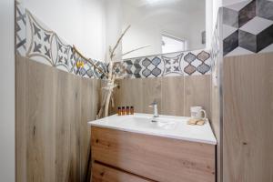 a bathroom with a sink and a mirror at Gabbiano 2 - Sea Loft in Bari +12 photos