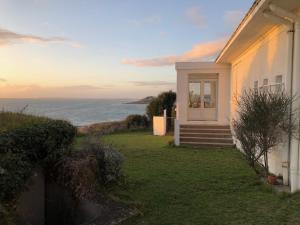 a white house with a view of the ocean at Maison face mer ! in Pornichet +40 photos