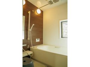 a bathroom with a bath tub and a sink at Keiryusou - Vacation STAY 50707v in Kinokawa +46 photos
