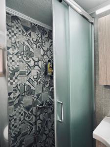a shower with a glass door in a bathroom at Porta Mesta in Chios +13 photos