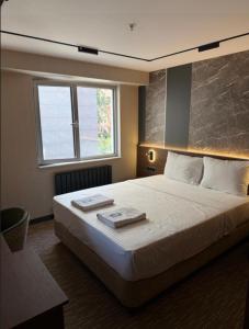 Postel nebo postele na pokoji v ubytování Tetrainn hotel + 3 fotografie