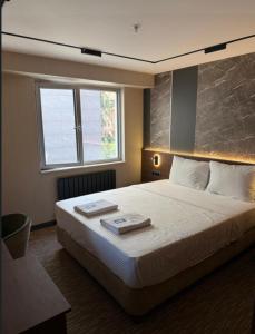 Postel nebo postele na pokoji v ubytování Tetrainn hotel