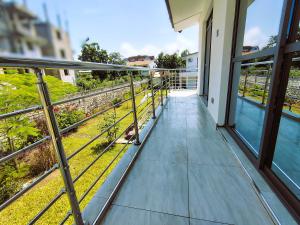 a balcony with a view of a yard at Chui de eagle in Mombasa