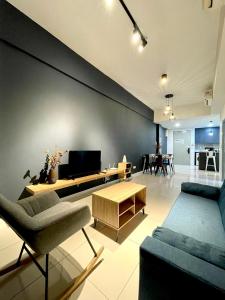 a living room with a couch and a table at Sutera Avenue Opposite Imago Shopping Mall KK in Kota Kinabalu