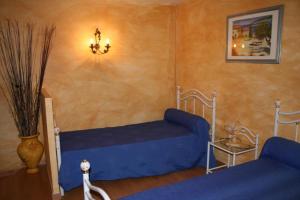 Postel nebo postele na pokoji v ubytování Domaine du coude