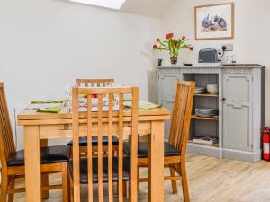 a dining room with a table and chairs at The Old Mill in Fettercairn