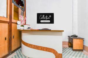 a counter at a restaurant with a sign on the wall at Collection O Lenin Sarani in Kolkata