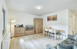 a living room with a table and a couch at Nice Apartment In Altenkirchen in Altenkirchen