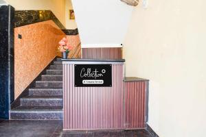 a set of stairs with a sign that reads californium at Townhouse Oak Puri Jagannatha Temple in Puri