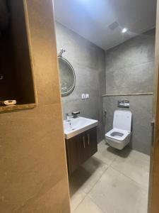 a bathroom with a sink and a toilet at Luxury Studio Zed Park Compound Sheikh Zayed in Sheikh Zayed +8 photos