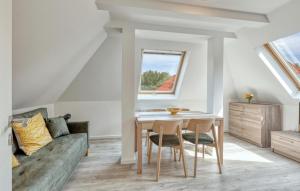 a living room with a table and a couch at Gorgeous Apartment In Altenkirchen in Altenkirchen