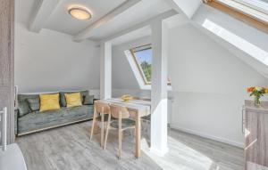 a living room with a table and a couch at Gorgeous Apartment In Altenkirchen in Altenkirchen