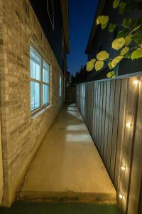 a hallway of a building with lights on it at Modern Family Home Sleeps 8 in Dallas