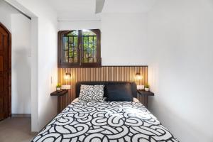 a bedroom with a bed and a window at Casa Tagoro Dream in Costa Del Silencio +16 photos