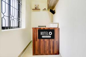 Un certificado, premio, letrero u otro documento en Hotel O Baga Beach Formerly Symphony Homes