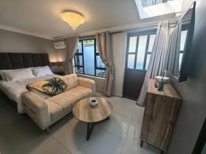 a living room with a couch and a coffee table at Bryanston Palms Accommodation in Johannesburg +37 photos