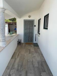 a hallway of a house with a door and a table at Casa Grande Abrunheiro Grande in Vila de Rei +74 photos