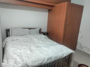 En eller flere senge i et værelse på Green House Resort