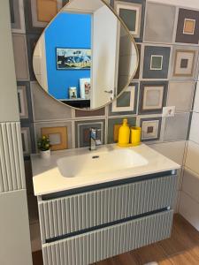 a bathroom with a sink and a mirror at A Casa di Giuseppa Natura bio in Caserta +52 photos