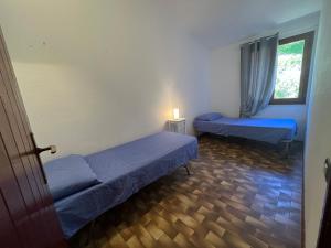 Ένα ή περισσότερα κρεβάτια σε δωμάτιο στο APPARTAMENTI BIANCANEVE by VILLA AUREA CAV