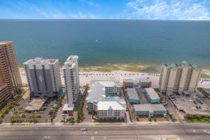 an aerial view of a beach with buildings and the ocean at Sea Glass Unit 209 in Gulf Shores