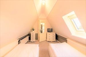 Voodi või voodid majutusasutuse Strandgut OG toas