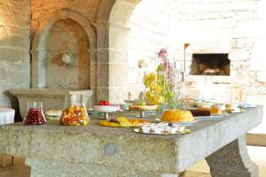 a table with many different types of food on it at Pousada Mosteiro de Amares in Bouro