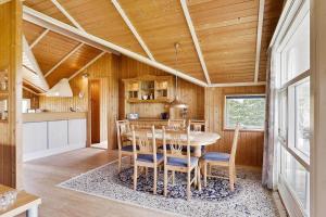 a kitchen and dining room with a table and chairs at N090-Karrebaeksminde-Krageholmsvej-72 in Enø By