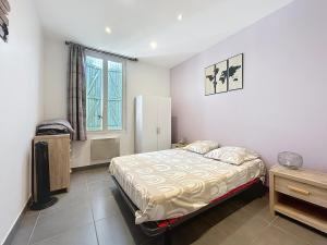 Postel nebo postele na pokoji v ubytování Le Blum - Appartement avec terrasse - Climatisation et Wifi