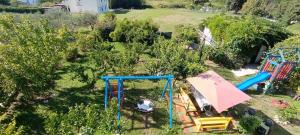 an aerial view of a yard with playground equipment at Dada Apartments in Lopar