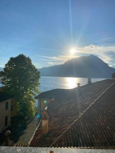a view from the roof of a house next to the water at La Fontana apartments in Fiumelatte