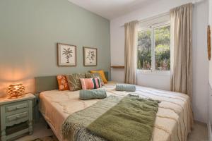a bedroom with a bed and a window at Casa BuenaVista Calpe in Casas de Torrat +23 photos