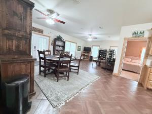 a dining room and living room with a table and chairs at Carlene's Place in Kingston +21 photos